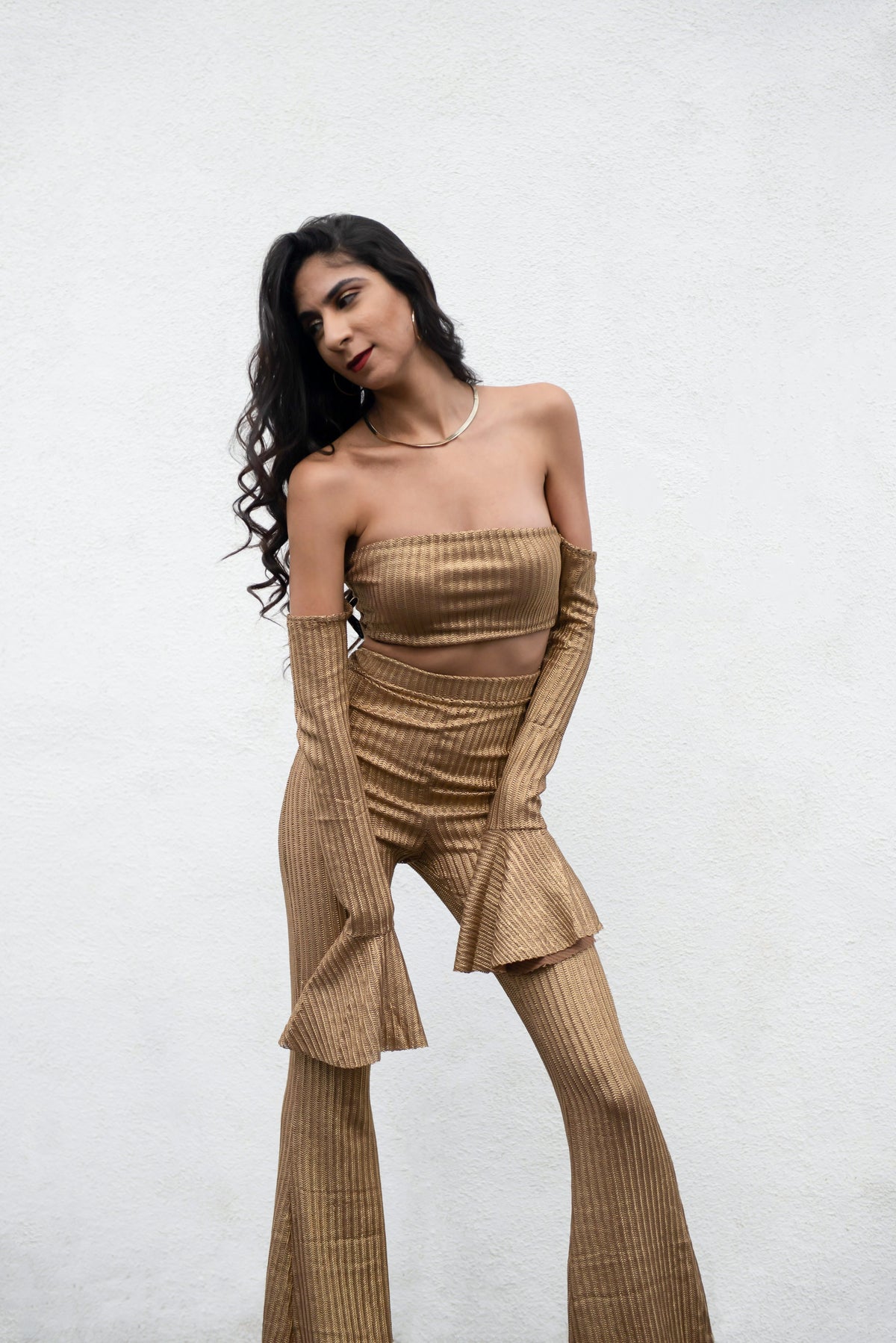 Off the shoulder gold knitted crop top.