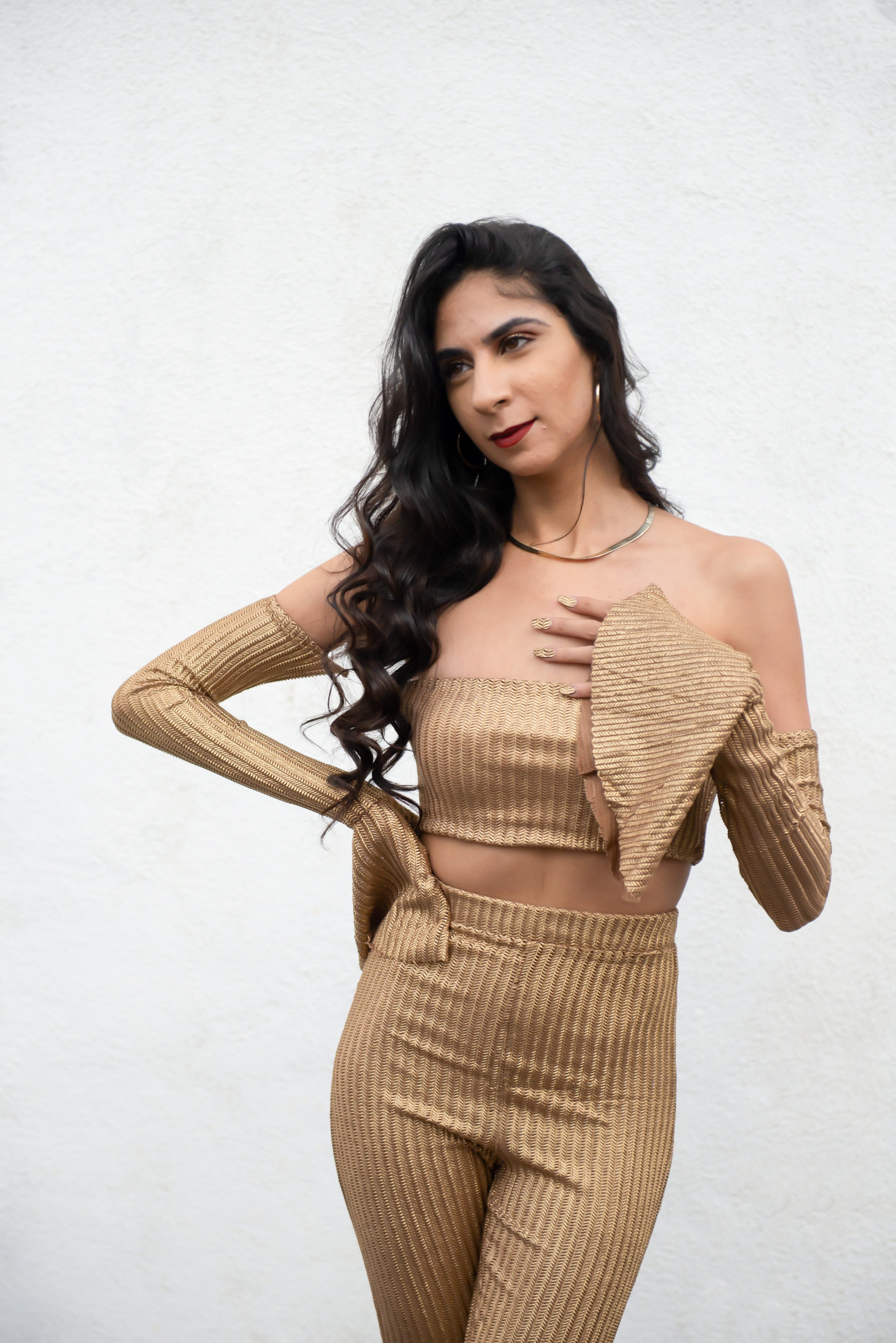 Off the shoulder gold knitted crop top.