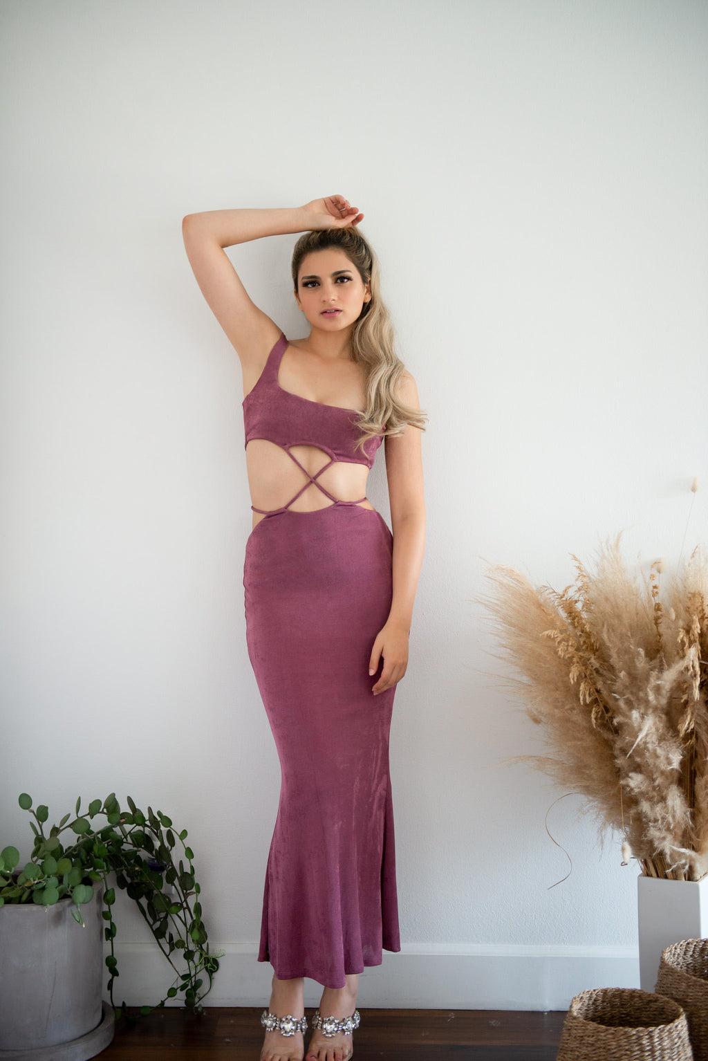 Purple midi dress with midriff cutouts.