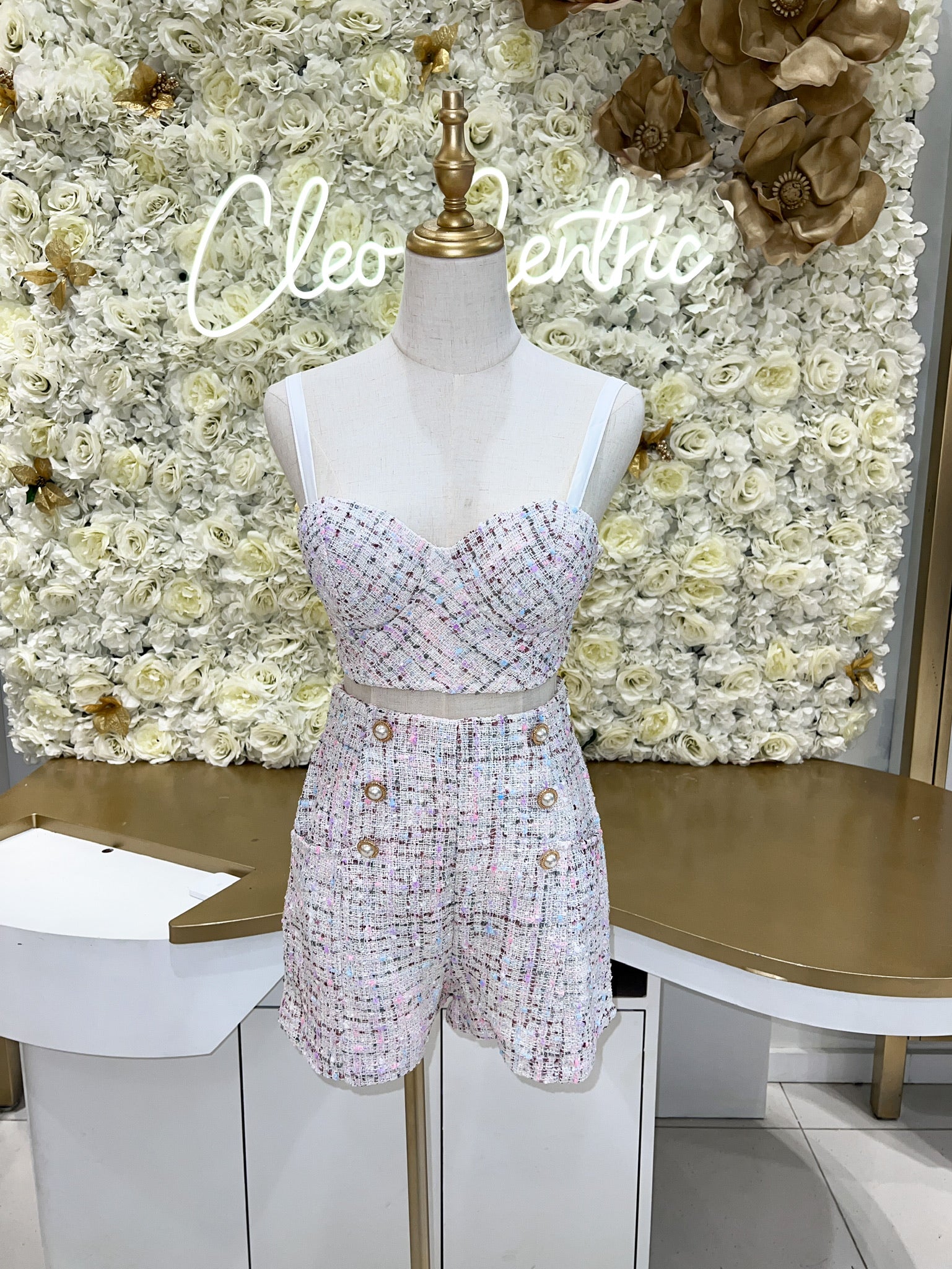 White tweed high waisted shorts paired with a tweed push up bustier.