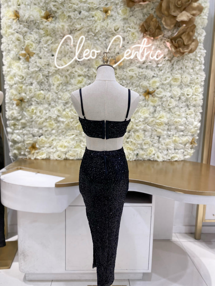 Sequin midi dress with side cutouts in black.