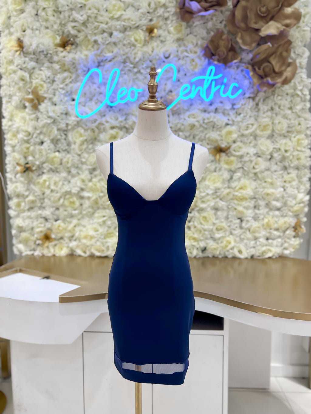 Spandex mini dress with adjustable straps and mesh details in blue.