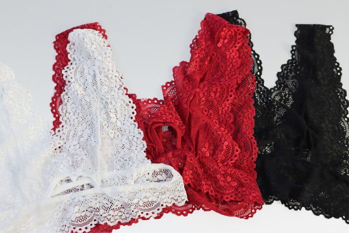 Lace bralette in white, red, and black.